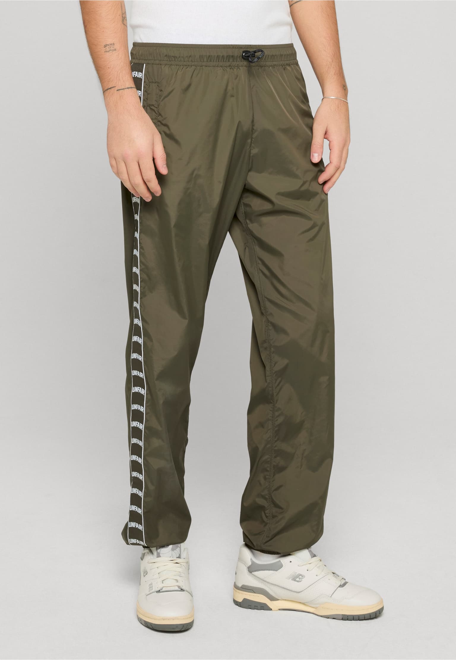 UNFAIR ATHLETICS Curved Tape Trackpants